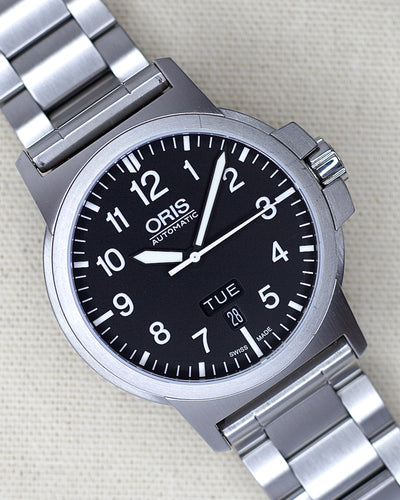 oris steel watch with black dial and numbers