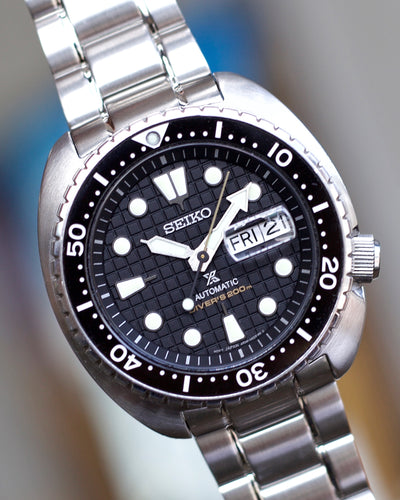Seiko steel watch with black waffle dial