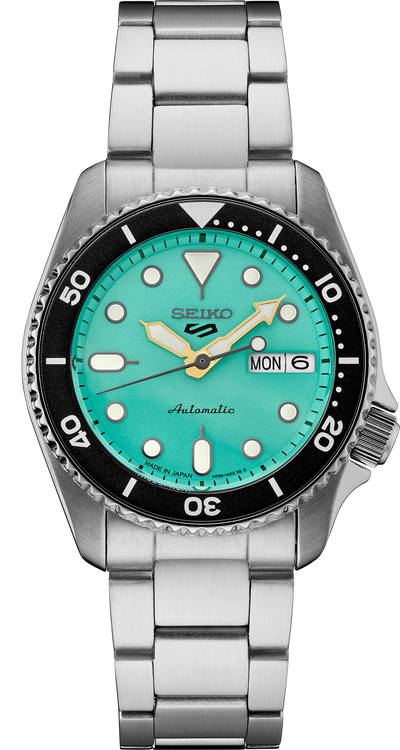 steel wristwatch with green dial and steel bracelet