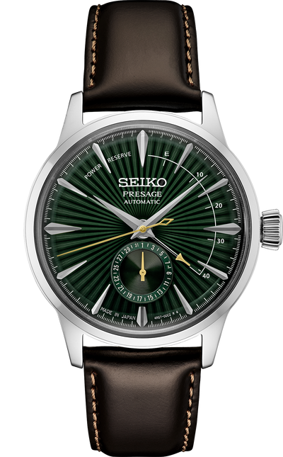 steel wristwatch on green dial and leather band