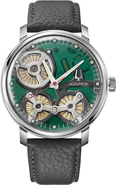 Steel wristwatch on movement revealing green dial and charcoal band