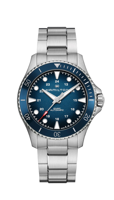 Steel wrist watch case with blue dial and steel bracelet