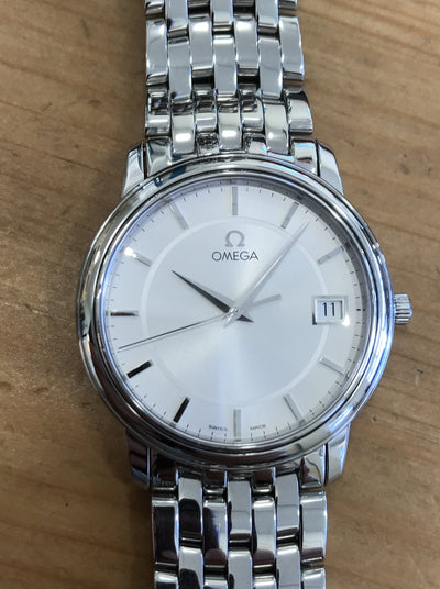 steel wrist watch with silver dial and steel bracelet