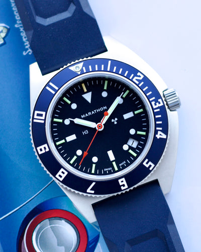 Marathon watch with blue strap and blue dial on a white background