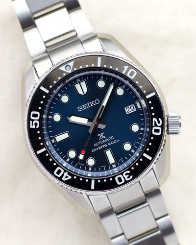 Seiko steel watch with blue dial and steel bracelet