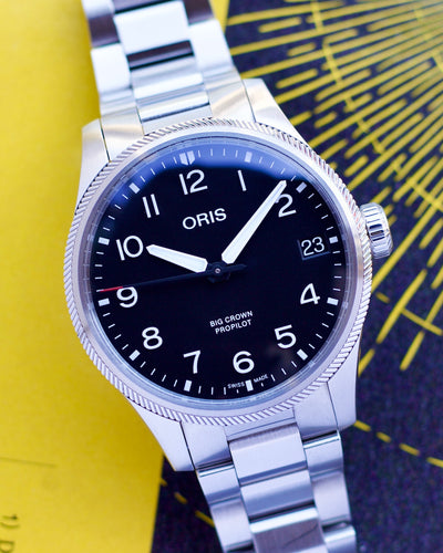 Oris steel wristwatch on black dial and steel bracelet