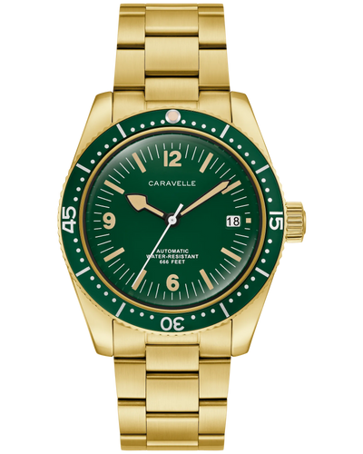 Gold watch with green bezel and face on a white background