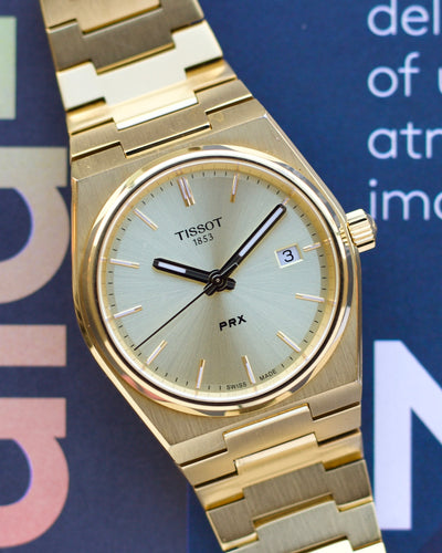 Tissot gold tone watch