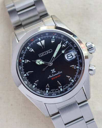 Seiko steel watch with black dial and steel bracelet