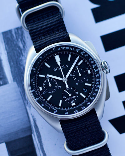 Bulova steel wristwatch on black dial and black strap