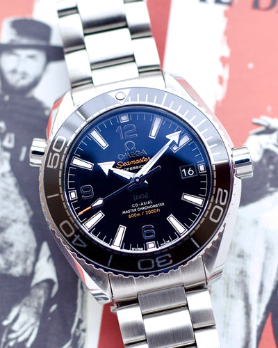 Silver watch with blue dial on a vintage-style background