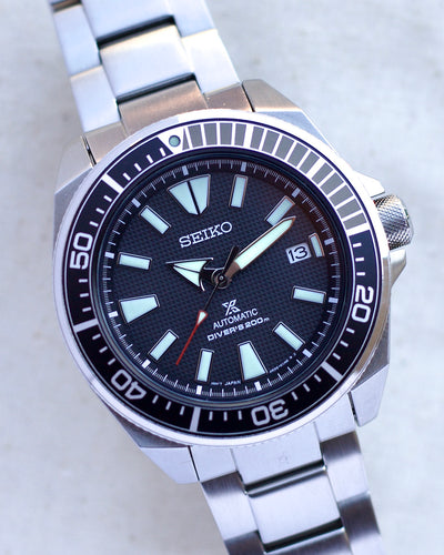 Seiko steel watch with black waffle texture dial