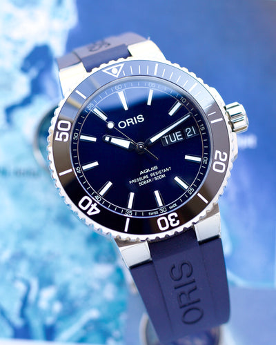 Oris watch with blue strap and face on a blue background