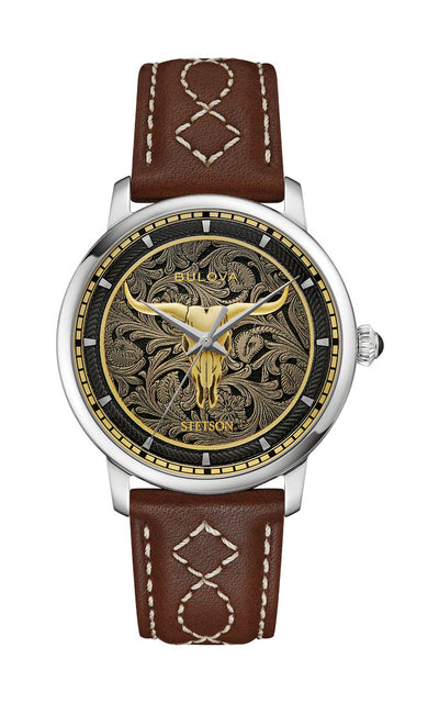 Watch with brown leather strap and intricate design on face against white background
