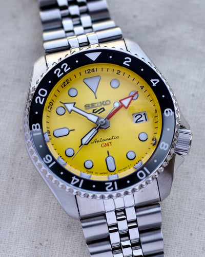 Seiko steel watch with yellow dial