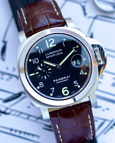 Panerai Luminor Marina watch with brown leather strap on a blurred background