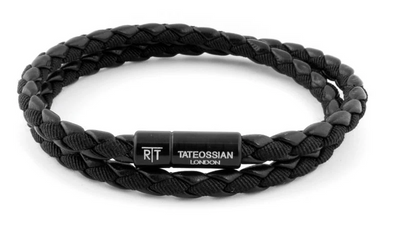 Black braided bracelet with a visible brand tag on a white background