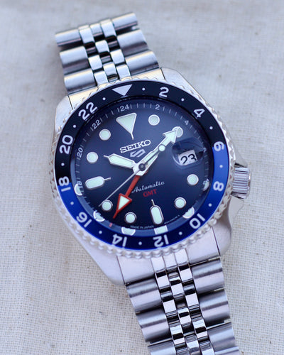 seiko steel watch with blue dial