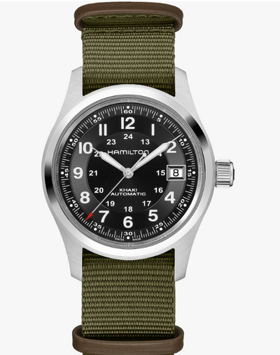 Hamilton watch with green strap and black dial on a white background