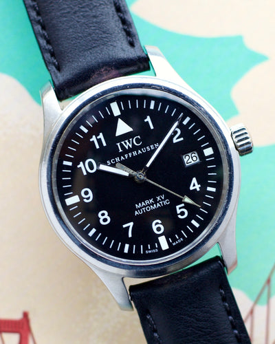 IWC steel watch on black dial and leather band