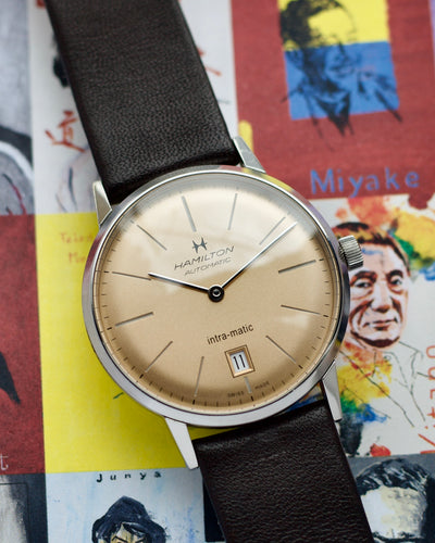 Hamilton intramatic steel watch with colorful background 