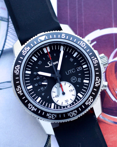 Sinn chronograph gmt watch in steel and black rubber band