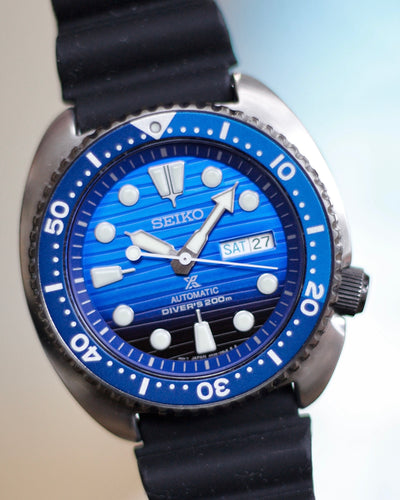 Seiko Steel watch with blue dial and black rubber band 