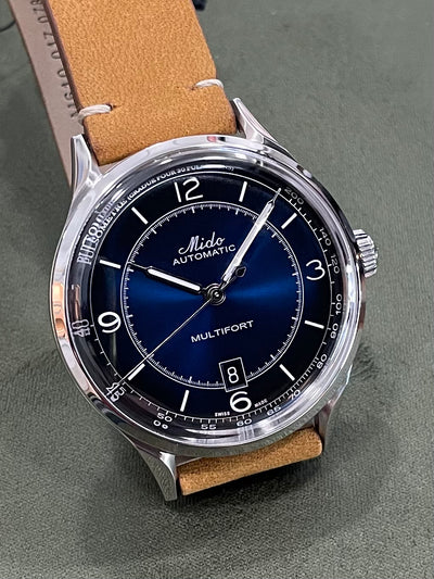 Mido steel watch on blue dial and steel case