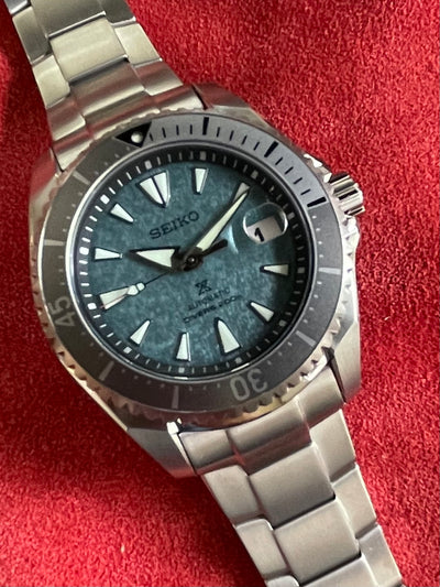 Seiko titanium watch with a turquoise color dial