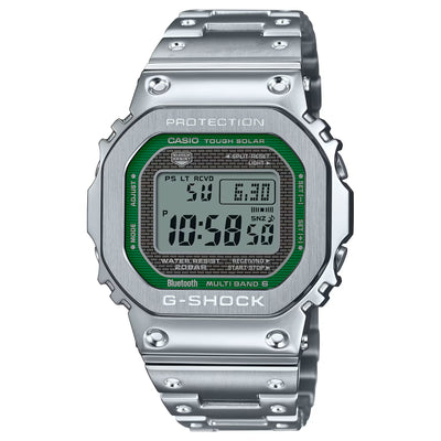 Silver G-Shock digital watch with green display on a white background