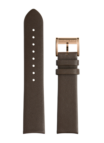 Brown leather watch strap with rose gold Hamilton buckle on a white background