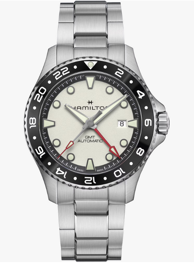 Hamilton watch with silver bracelet and black bezel on a white background