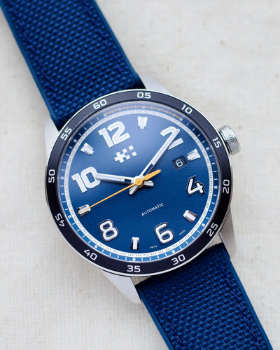 Steel watch with blue dial and blue rubber strap