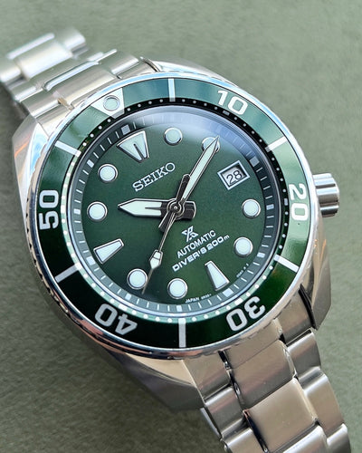 Seiko Steel watch on green dial and steel bracelet
