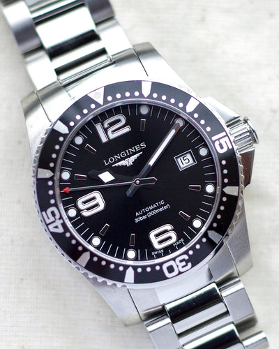 longines steel watch with black dial