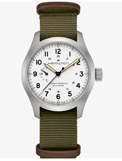 Hamilton watch with green strap and white face on a white background