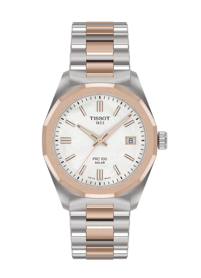 Tissot watch with silver and rose gold band on white background