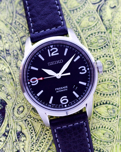 Seiko steel watch with leather band