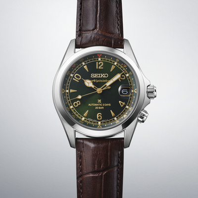 Seiko watch with brown leather strap on a light gray background