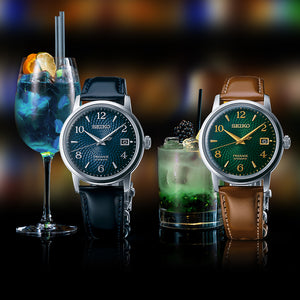 a blue and a green watch walk in a Cocktail bar 