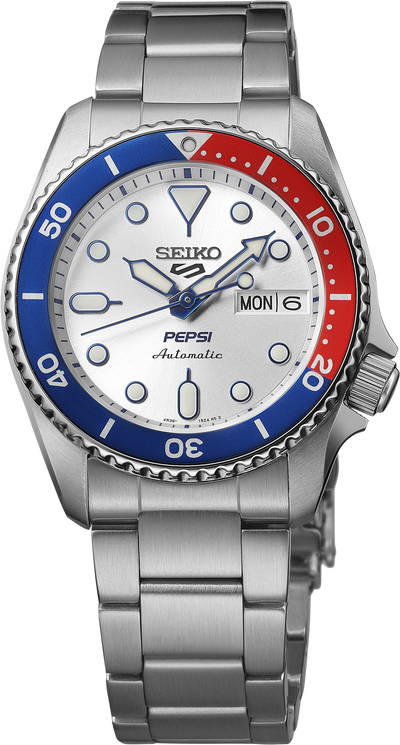 Seiko Pepsi watch with silver bracelet and red and blue bezel on a white background