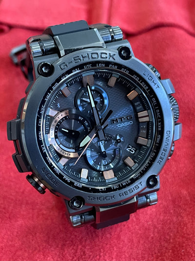black steel watch with black dial