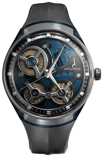 Steel wristwatch on blue movement revealing dial on black strap
