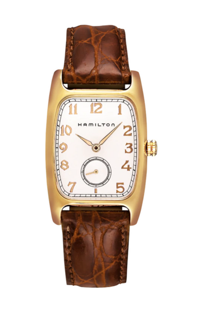 Gold tone wristwatch on white dial and brown leather band