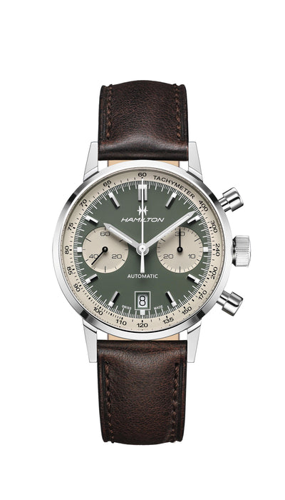 Steel wrist stop watch with green and white dial on brown leather
