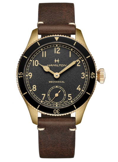 Bronze wristwatch on black dial and brown band