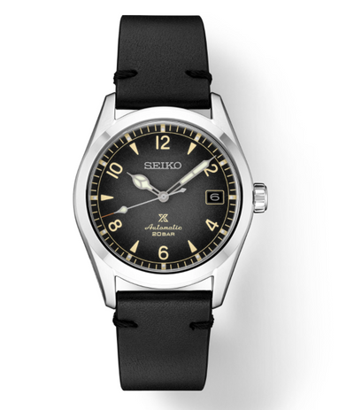 steel wrist watch black band and dial