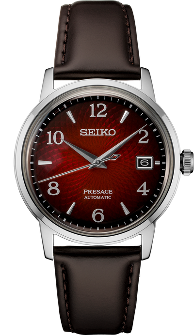 steel wrist watch on red dial and brown leather band