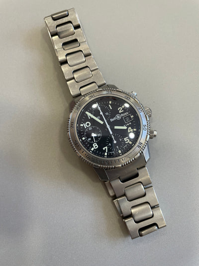 Titanium gray wristwatch on black dial 