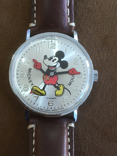 wrist watch steel case white dial with mickey mouse and brown leather band 